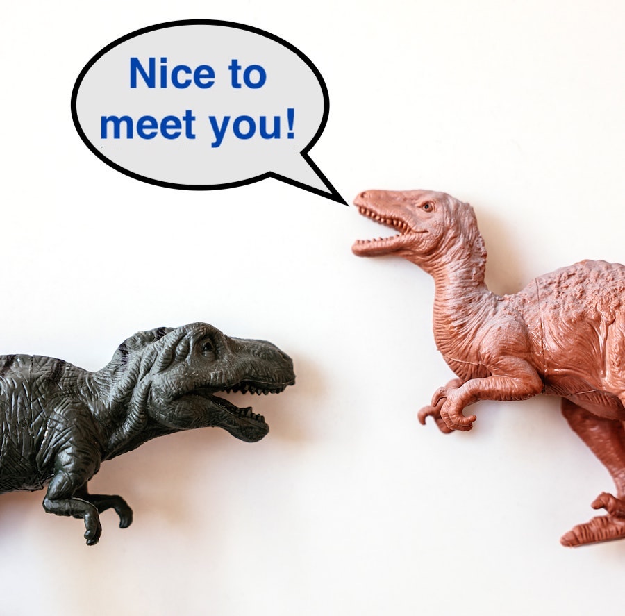 Two dinosaurs saying nice to meet you