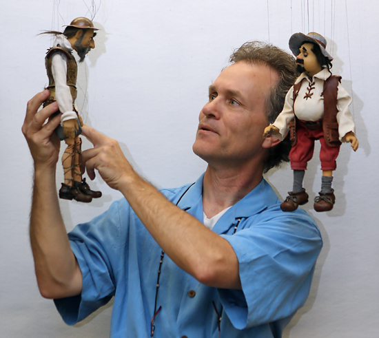 Steven Ritz-Barr working with two puppets